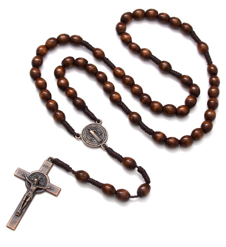 Wooden rosary with a crucifix and a medallion on a white background