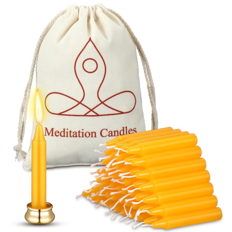 Lit meditation candle, bag with logo, and stack of yellow candles