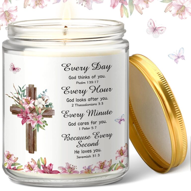 Lit candle in a jar with a cross, flowers, and inspirational text