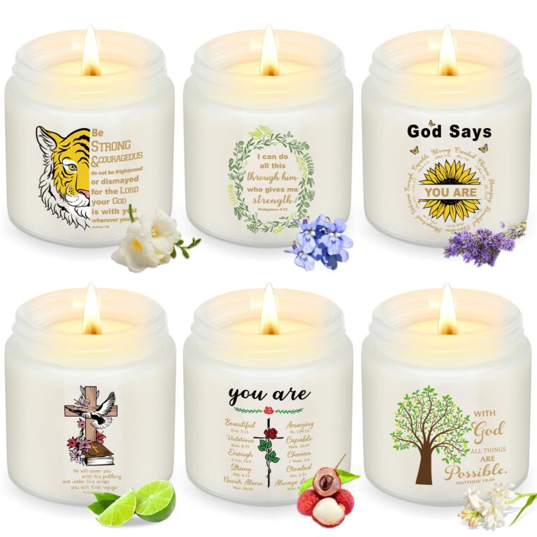 Six lit candles with inspirational quotes, floral designs, and fruit accents