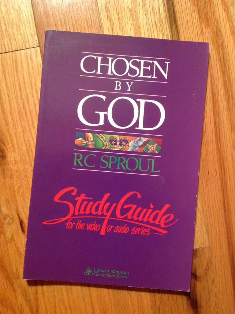 Purple "Chosen by God" study guide book by R.C. Sproul on a wood surface