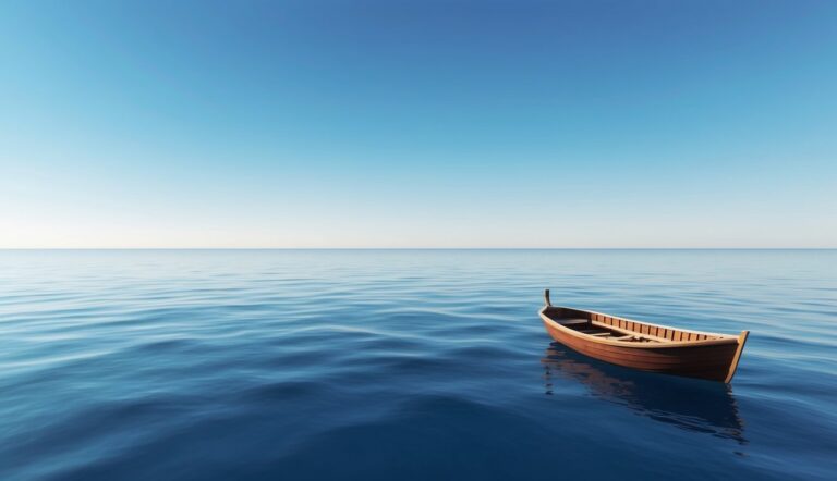 Wooden rowboat floating on calm blue water under a clear sky