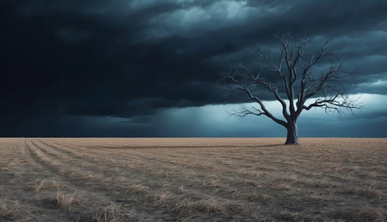 Bare tree in a field under a dark, stormy sky